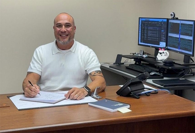 Wong at his desk in Topeka