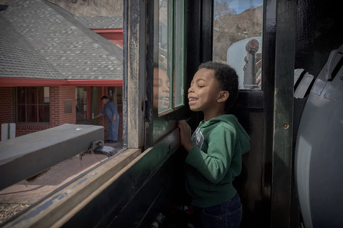 Daecian on a train at the age of 5 at the Colorado Railroad Museum