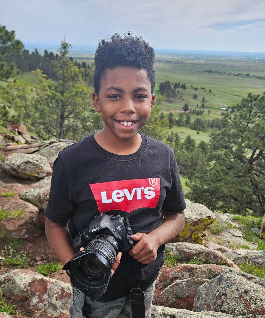 Daecian holding his camera.